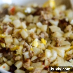 Air Fryer Breakfast Hash with crispy potatoes, sausage, and egg
