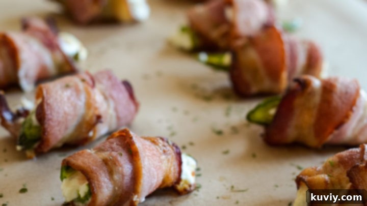 Irresistible Air Fryer Bacon Wrapped Jalapeño Poppers, filled with cream cheese.