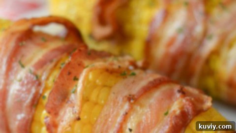 Savory Air Fryer Bacon Wrapped Corn on the Cob, a delicious side dish.