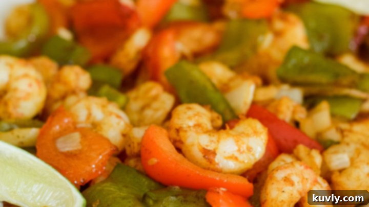 Delicious Air Fryer Shrimp Fajitas with bell peppers and onions, ready to be served.