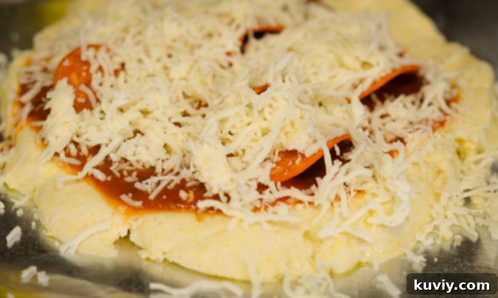 Crispy Gluten-Free Air Fryer Pizzas 3 Close-up of a gluten-free air fryer pan pizza with pepperoni, ready to be cooked.