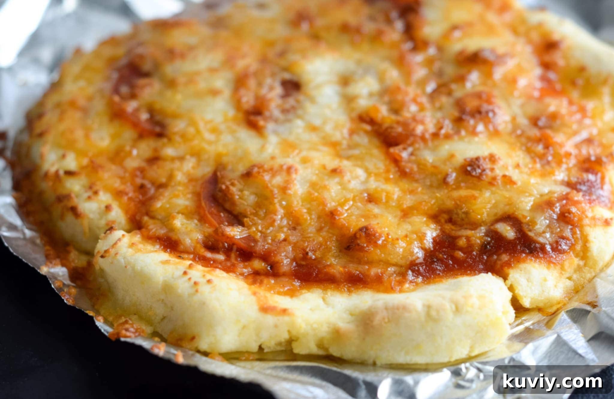 Crispy Gluten-Free Air Fryer Pizzas 4 Air Fryer Pan Pizza with classic pepperoni and cheese, golden brown crust.