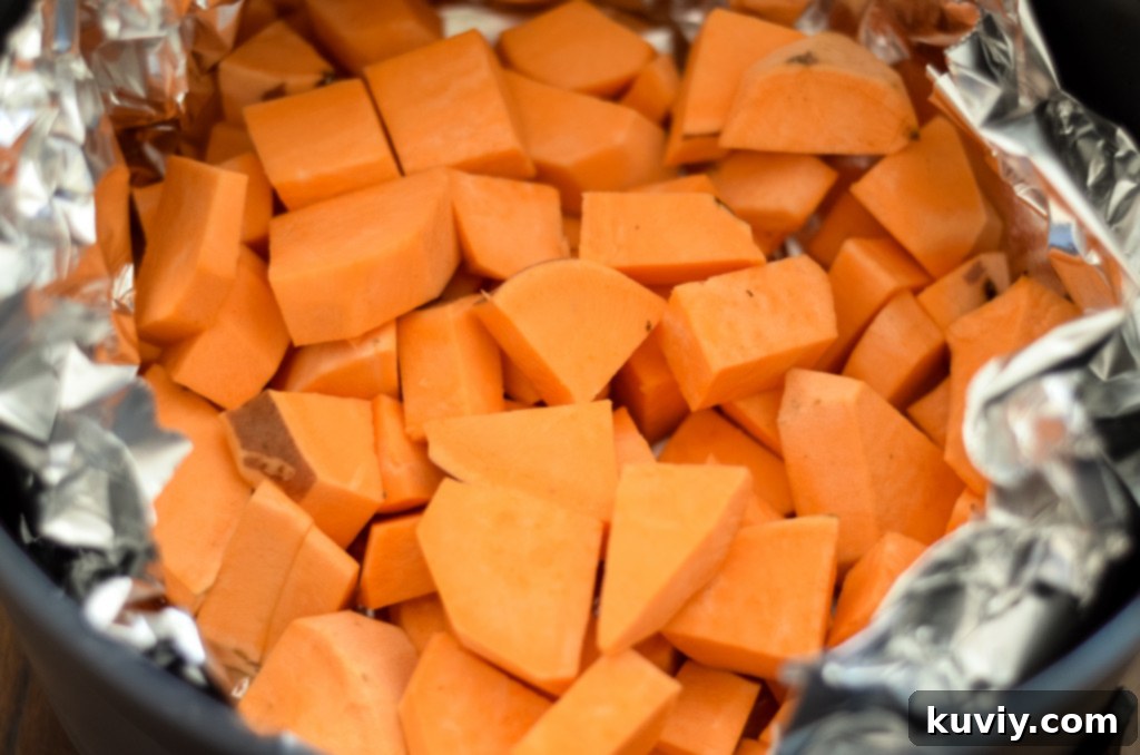 Crispy Air Fryer Sweet Potato Hash 4 air fryer sweet potato hash ingredients mixed in a bowl