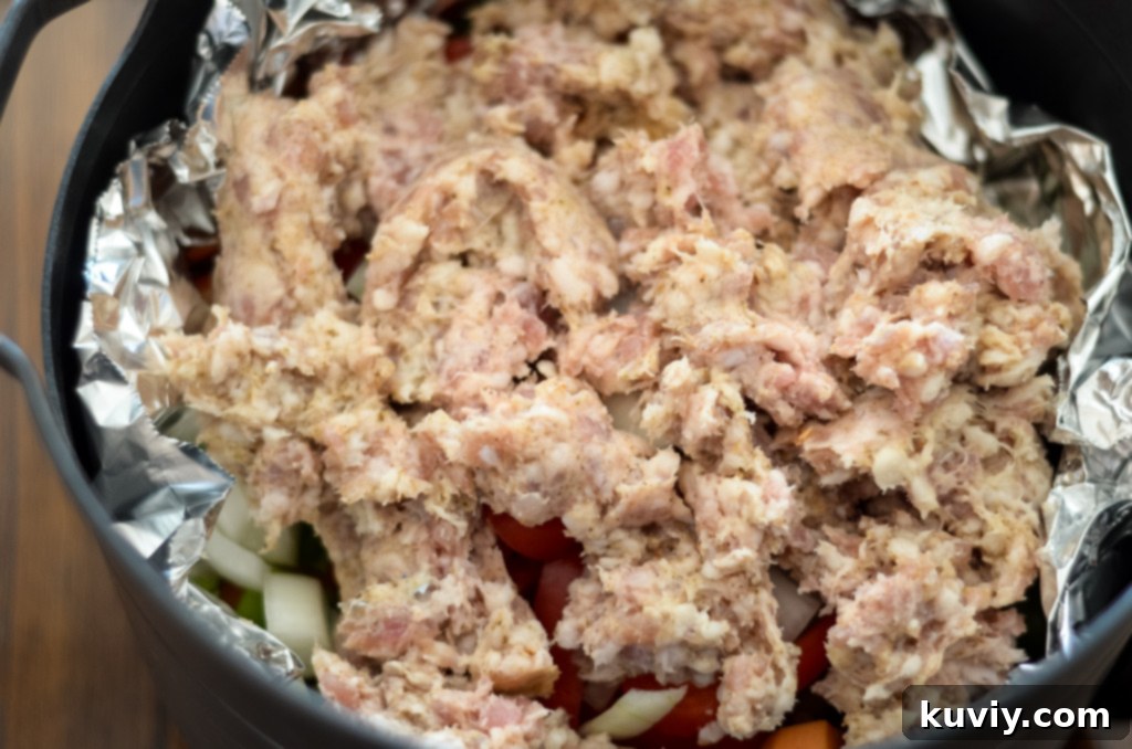 Crispy Air Fryer Sweet Potato Hash 5 air fryer basket lined with aluminum foil, ready for sweet potato hash