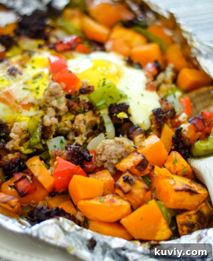 Crispy Air Fryer Sweet Potato Hash 6 sweet potato hash cooking in an air fryer, showing the foil lining