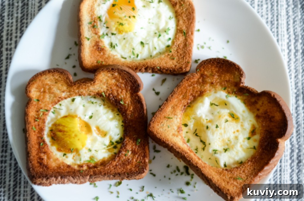 Air Fryer Eggs in a Basket ready to be served, showing the golden toast and egg.