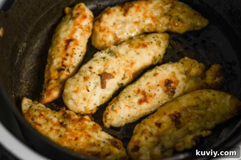 Crispy Air Fryer Ranch Chicken Tenders 3 air fryer chicken tenders in air fryer basket