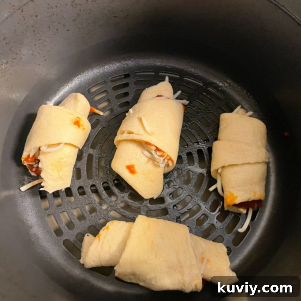 Unrolling Pillsbury crescent rolls for air fryer pizza