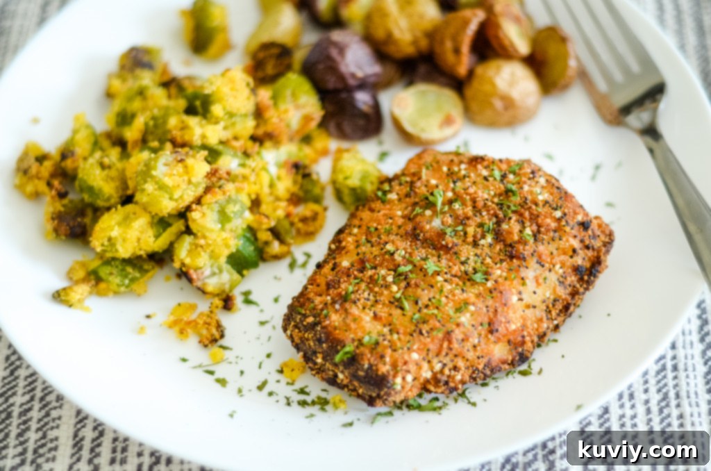 Close-up of golden-brown air fryer cod fillets, showcasing their crispy texture
