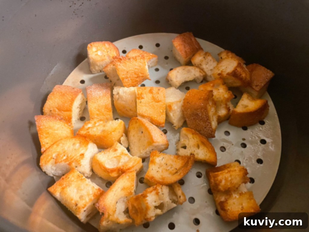 Different types of bread cut into cubes for air fryer croutons