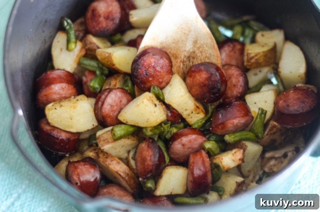 Sliced kielbasa sausage in a uniform 1/4 inch thickness, ready for air frying