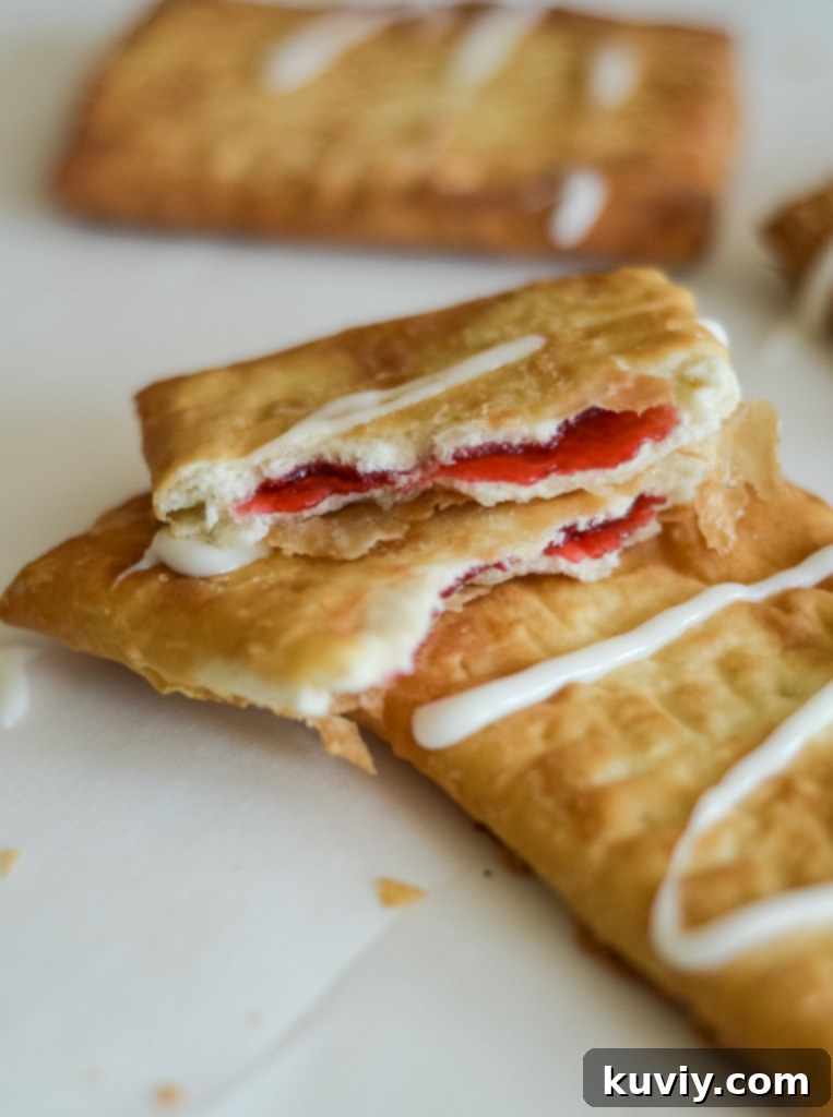Air Fryer Toaster Strudel Hack 2 Crispy Air Fryer Toaster Strudel, golden brown and ready to be iced for a quick breakfast.