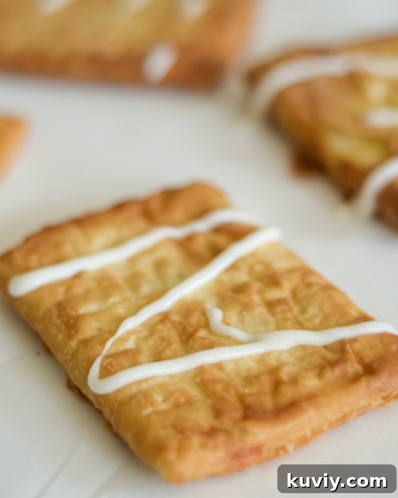 Air Fryer Toaster Strudel Hack 5 Grapeseed oil spray being applied to an air fryer basket before adding Toaster Strudels.