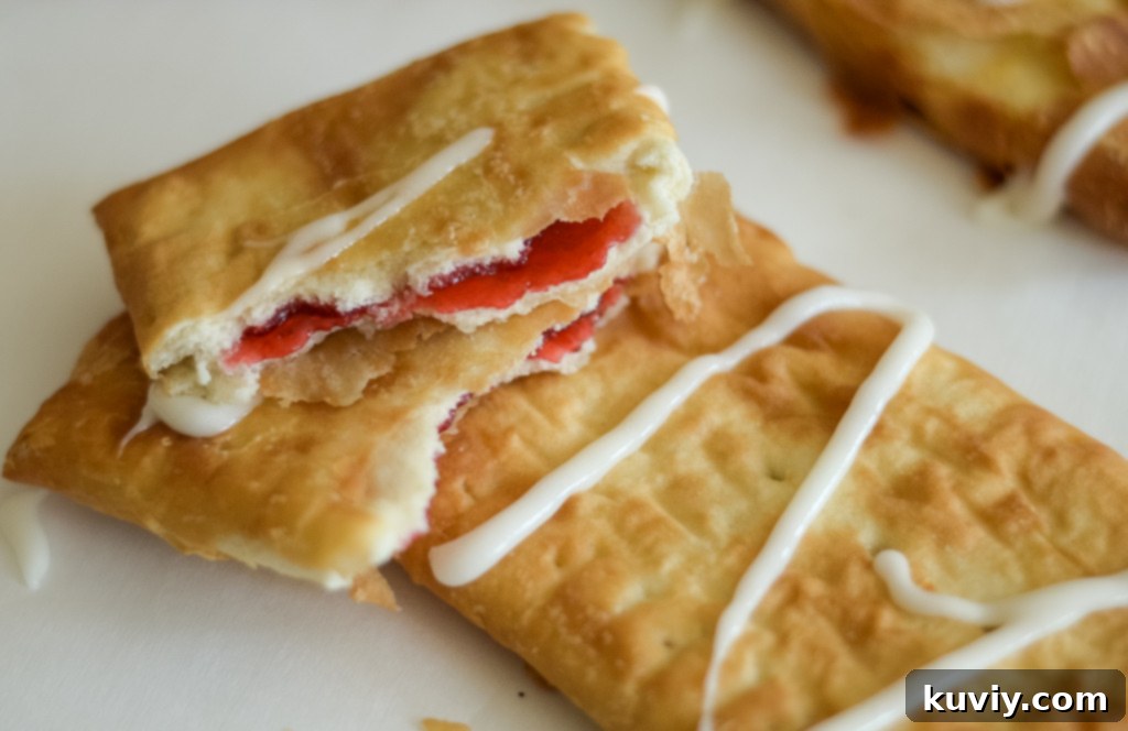 Air Fryer Toaster Strudel Hack 6 Toaster Strudels arranged in a single layer in an air fryer basket, with space for air circulation.