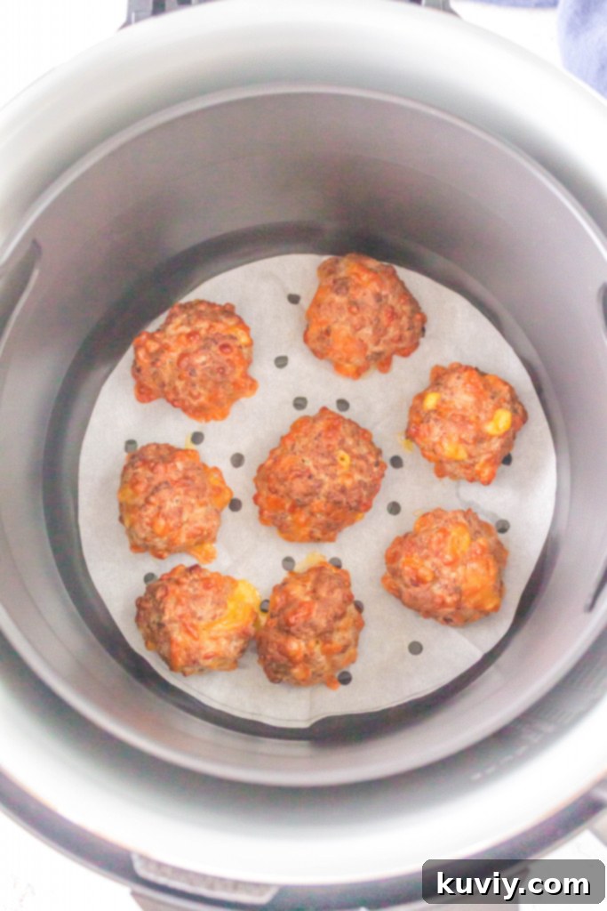 Hand scooping Air Fryer Sausage Ball dough into uniform portions