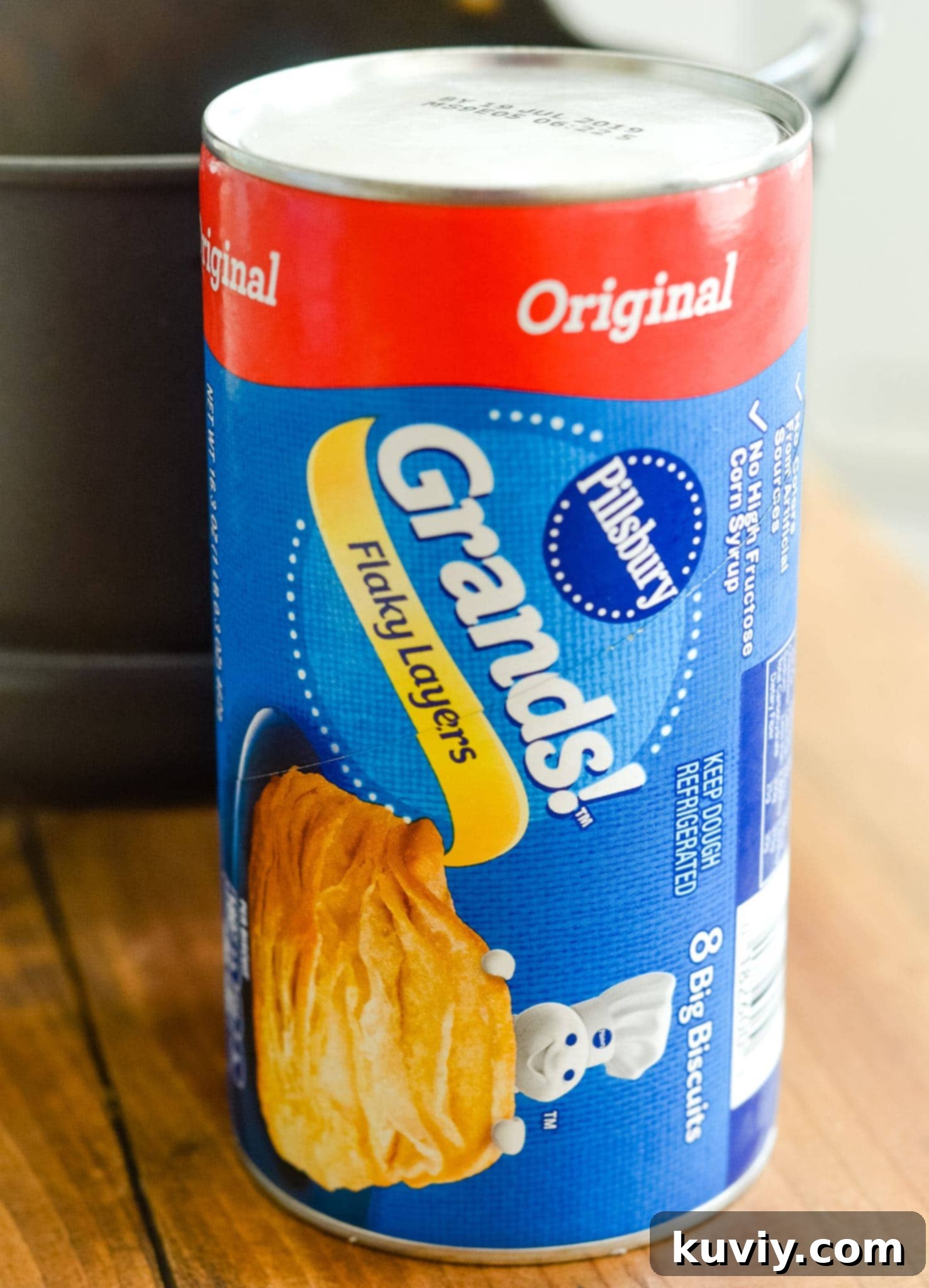 Canned flaky biscuits ready to be cut into donut shapes