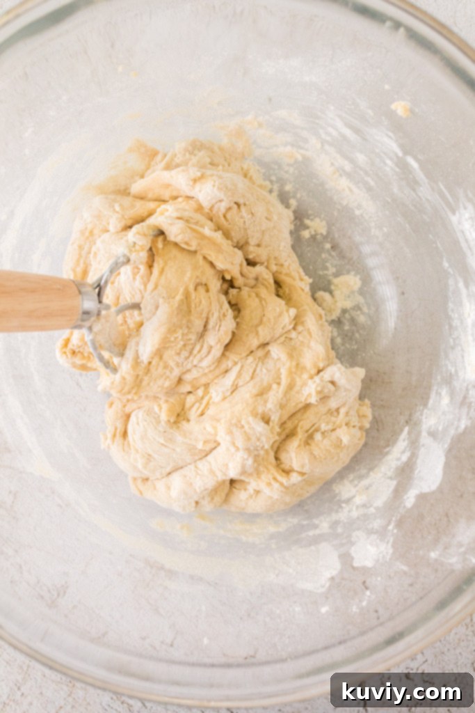 Air fryer dinner roll dough after rising, ready to be shaped