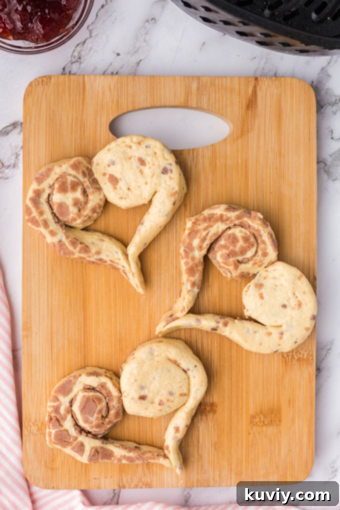 Sweetheart Air Fryer Cinnamon Rolls 5 Assembling heart shape with two cinnamon roll halves