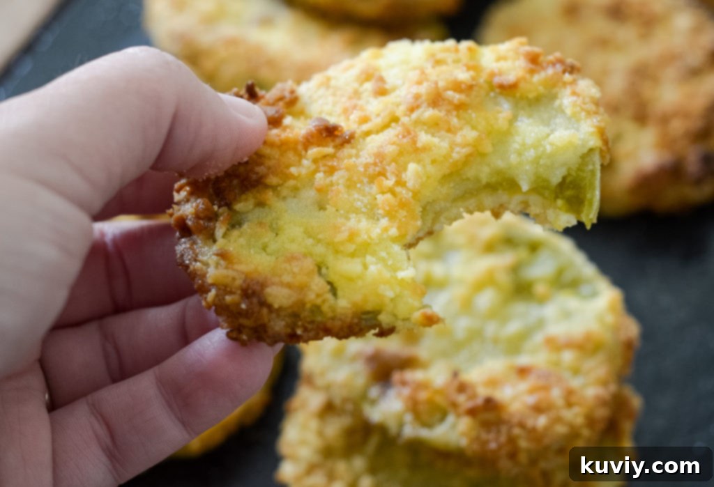 Air Fryer basket lined with foil, ready for fried green tomatoes