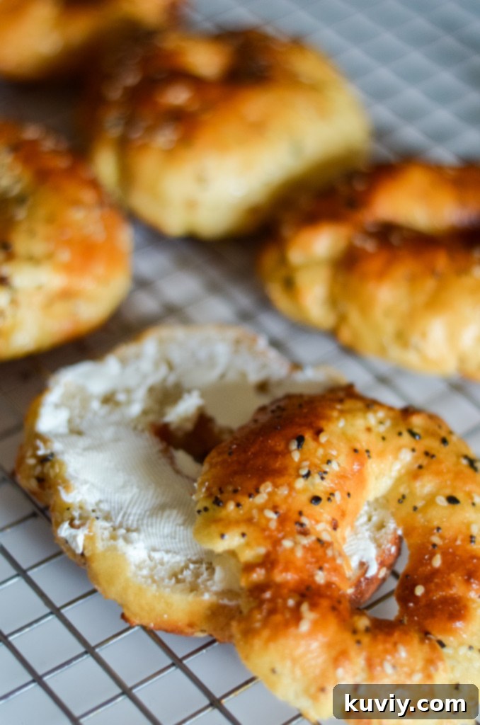 Delicious golden brown air fryer everything bagels arranged on a white cutting board
