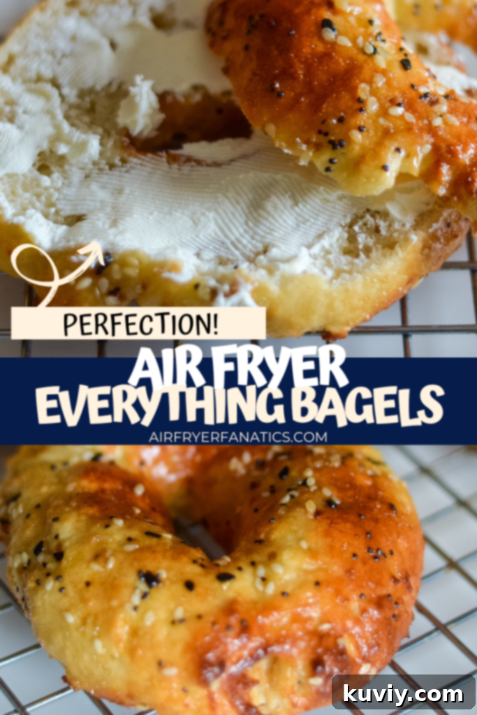 Two freshly air-fried everything bagels on a cooling rack, with one sliced open to reveal a soft interior