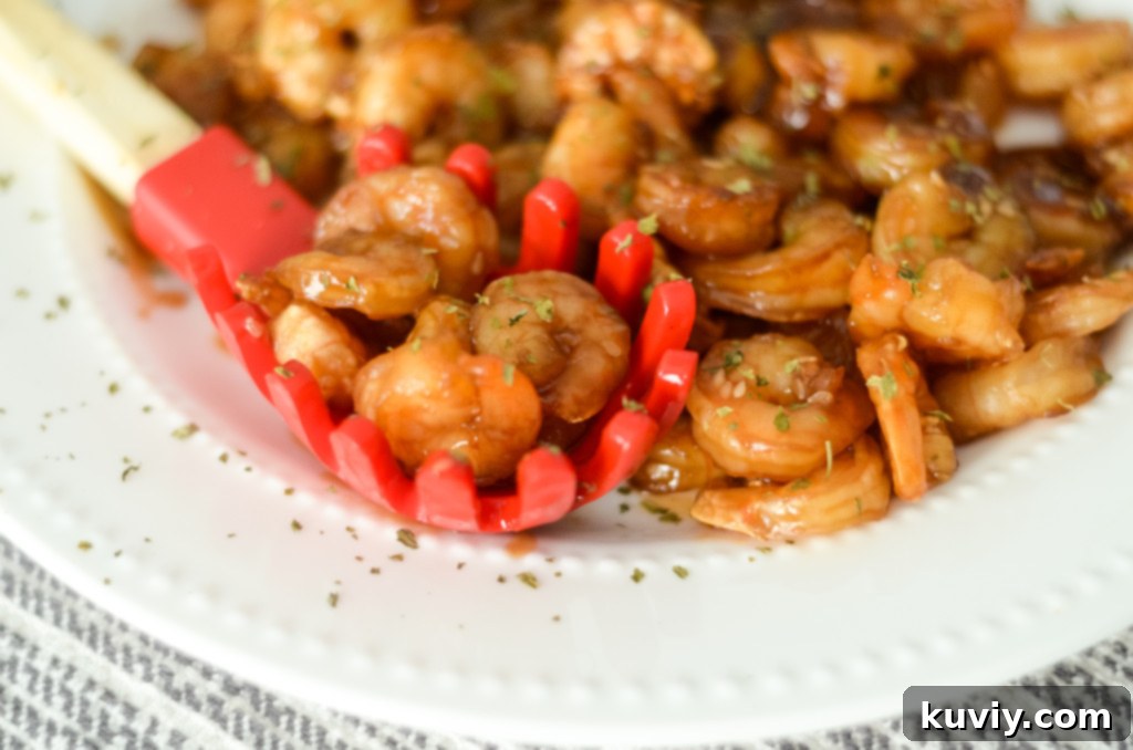 Air Fryer basket filled with coated sesame shrimp