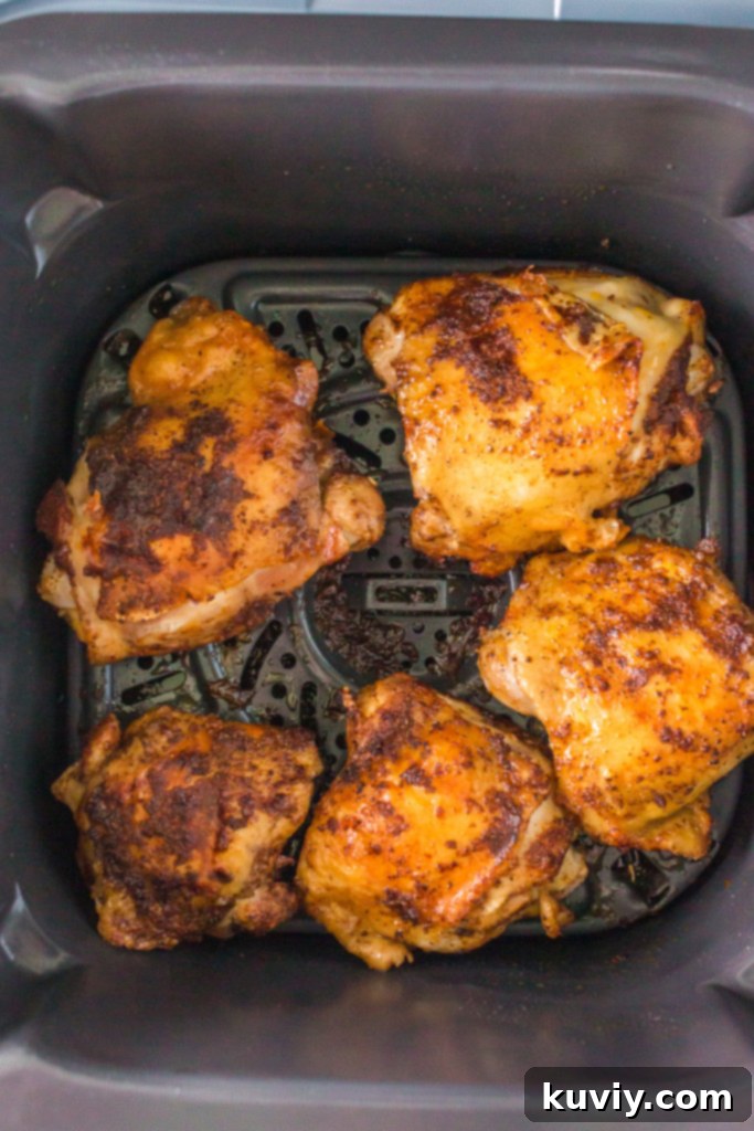 Checking the temperature of Air Fryer BBQ Chicken Thighs
