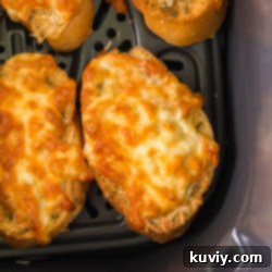 Air Fryer Cheesy Garlic Bread, freshly cooked and served.