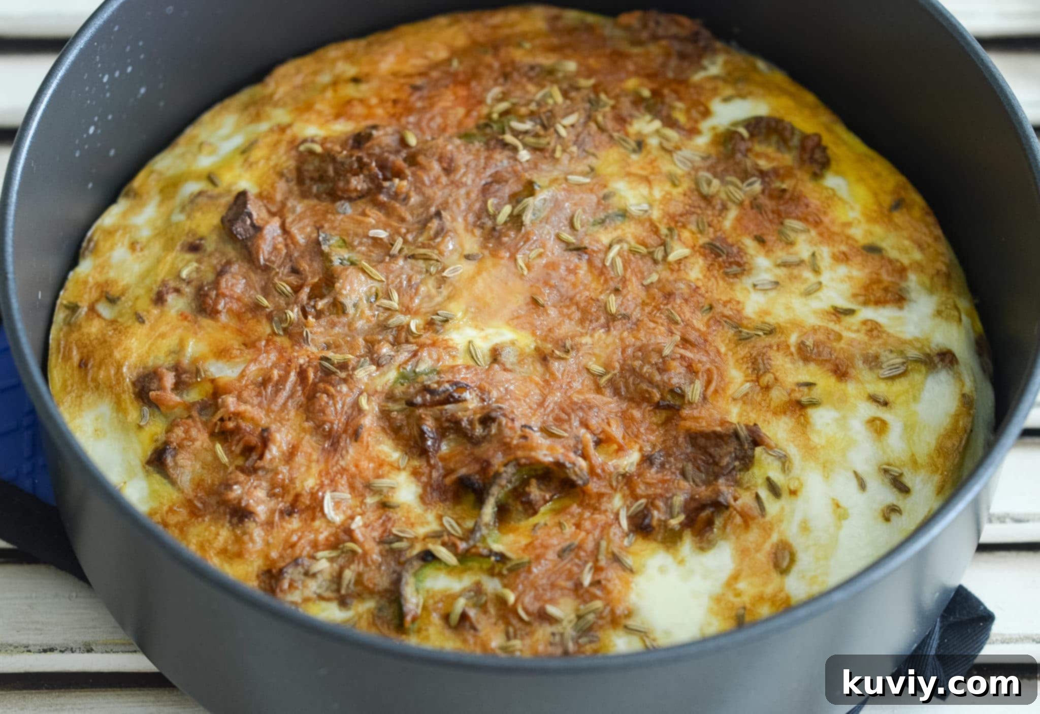 Air Fryer Low-Carb Breakfast Casserole cooking in an air fryer with a pan
