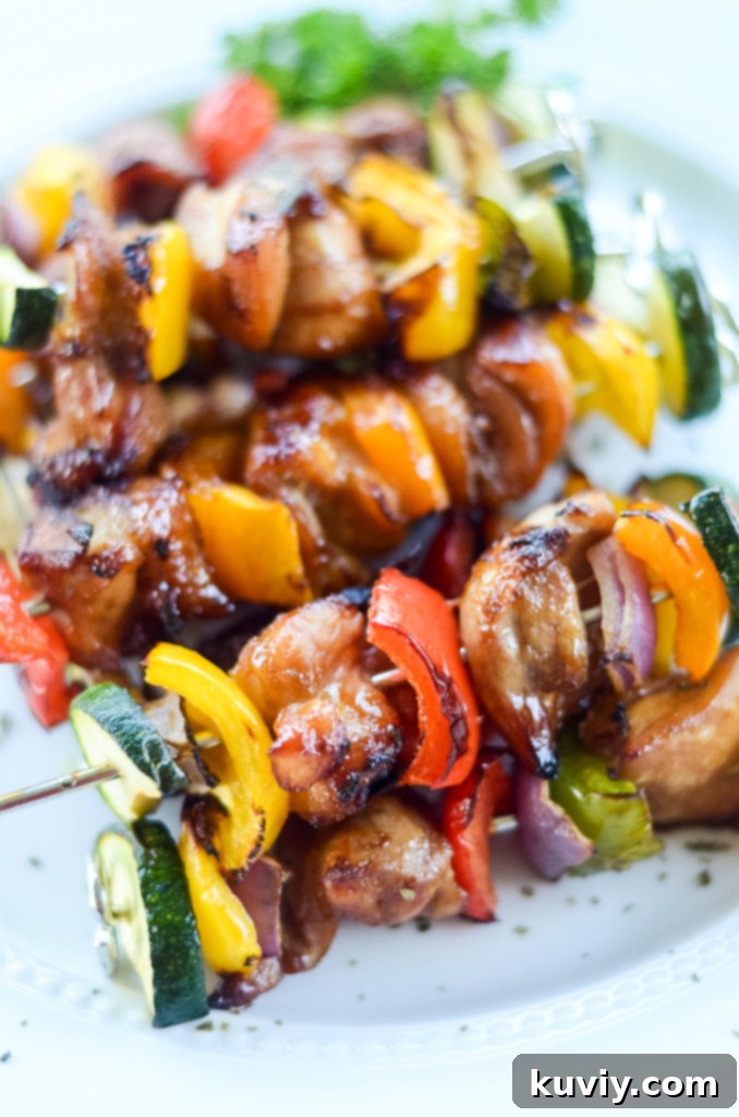 Perfectly cooked air fryer chicken kabobs with colorful bell peppers and red onion