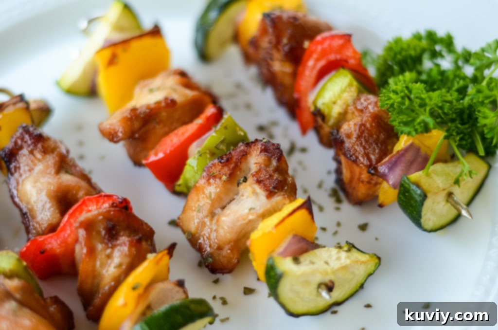 Close-up of air fryer chicken kabobs, showing the browned chicken and tender vegetables