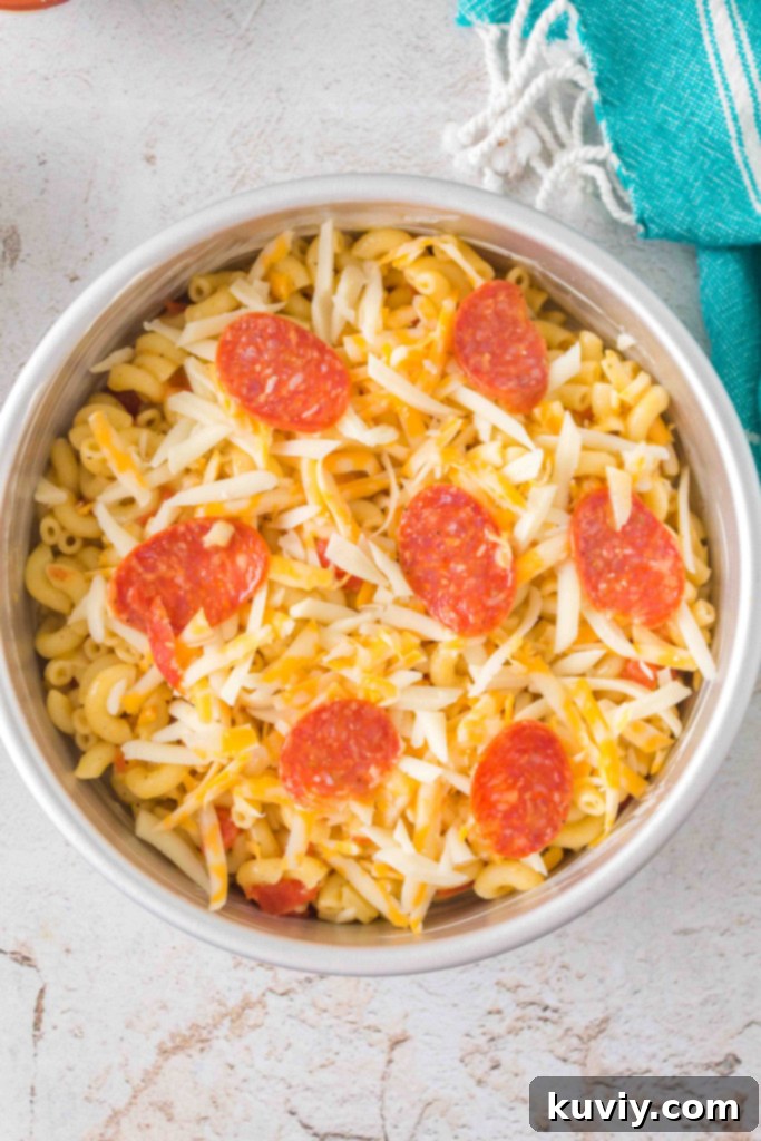 Close-up of Air Fryer Pizza Pasta showing elbow macaroni, pepperoni, and melted cheese