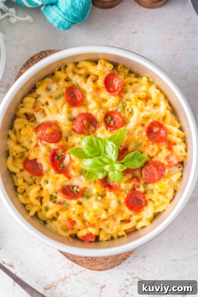 Air Fryer Pizza Pasta with melted cheese and pepperoni in a pan