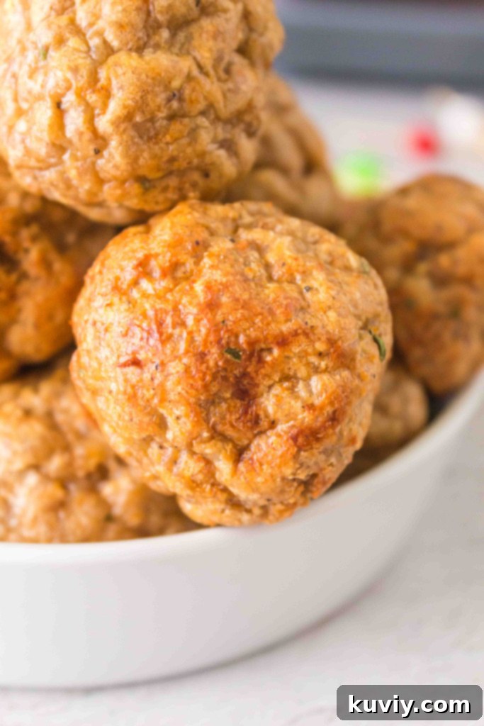 Crispy golden-brown air fryer turkey meatballs in a basket, ready to serve
