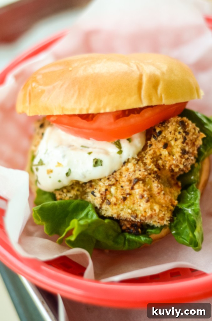 Crispy Air Fryer Fish Sandwiches with lettuce and tomato
