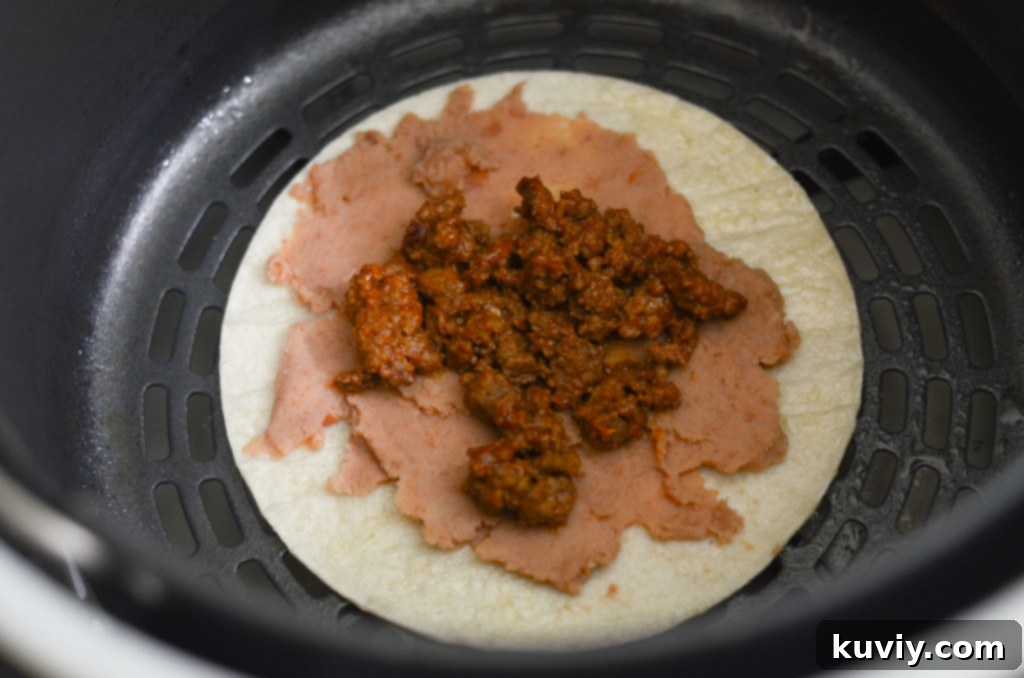 Grapeseed oil spray bottle next to air fryer tostadas