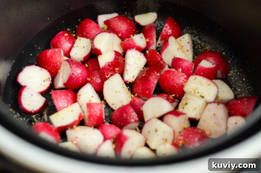 Radishes seasoned and oiled in air fryer basket