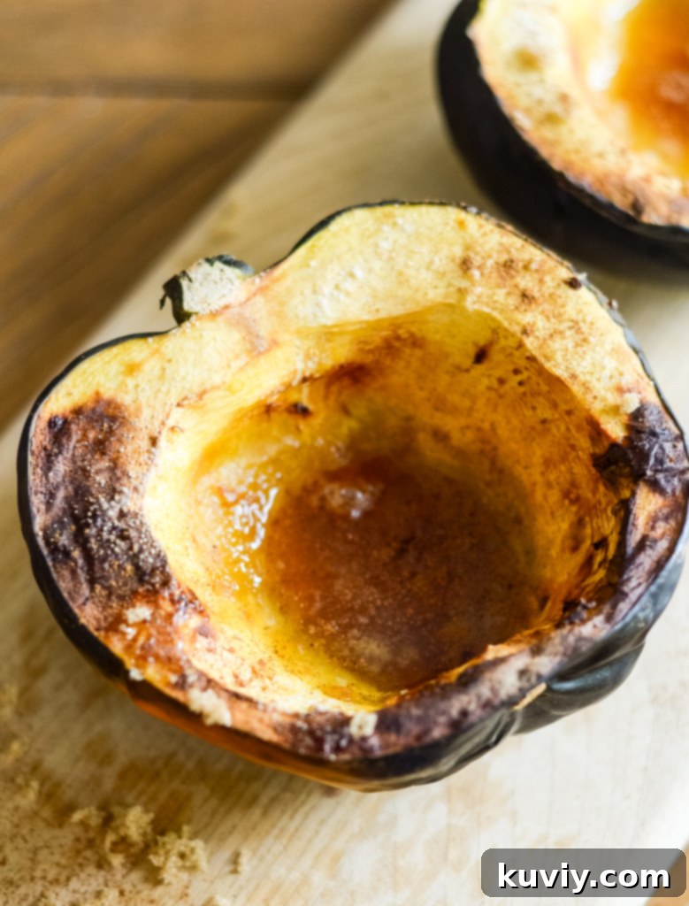 Perfectly cooked air fryer acorn squash halves with maple glaze